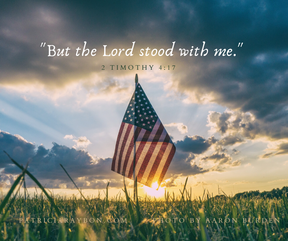 American flag in field with scripture "but the Lord stood with me."